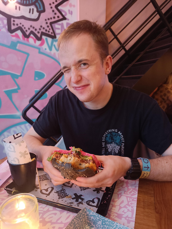 a person eating a burger (me)